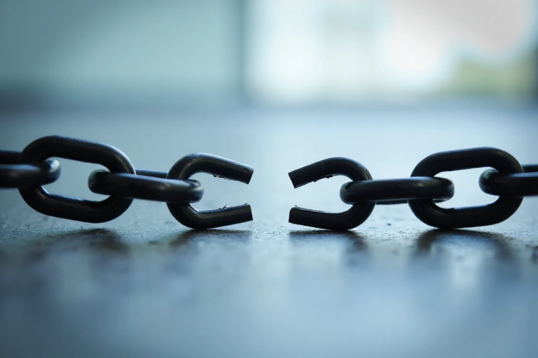 Abstract illustration of a broken chain link, symbolizing disclaimers and limitations of liability